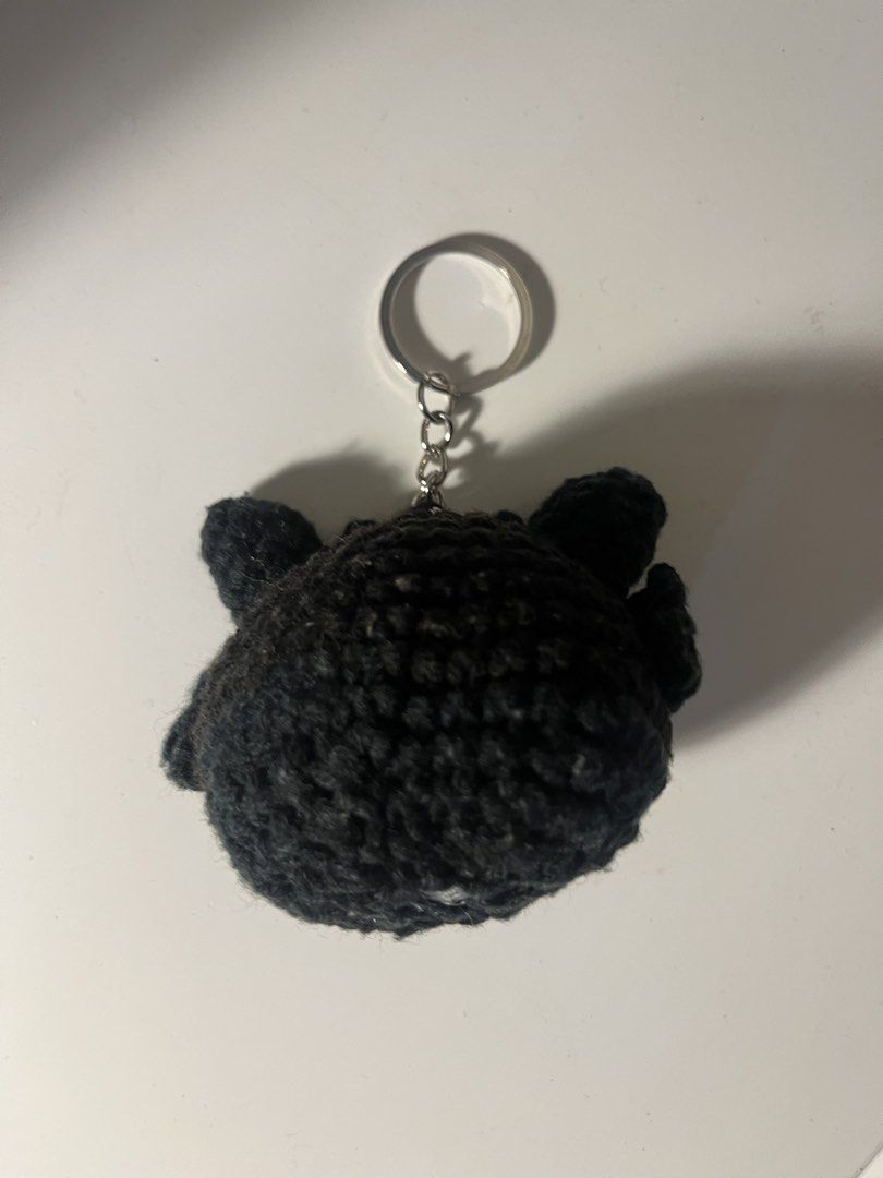 Crocheted Toothless Dragon Keychain (Category: Character Goods) located in Manila. Submitted by gentlefish_473ecf (Listing ID 1459004440, Image 3). Description: - Handmade crocheted keychain featuring Toothless from How to Train Your Dragon. - Classic black color with striking yellow eyes. - Comes with a durable metal keyring. - Ideal accessory for your bags, backpacks, or keys. - A unique and charming gift for fans!.