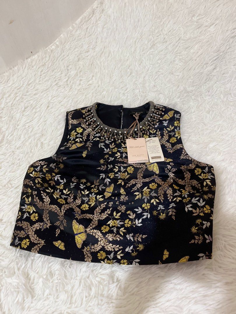 Crop Top (Category: Sleeveless) located in Caloocan City. Submitted by clscloset.621 (Listing ID 1458946846, Image 1). Description: XS-S Pristine Condition New with Tag and extra gems Original Price 10,500php .