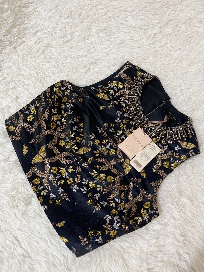 Crop Top (Category: Sleeveless) located in Caloocan City. Submitted by clscloset.621 (Listing ID 1458946846, Image 2). Description: XS-S Pristine Condition New with Tag and extra gems Original Price 10,500php .