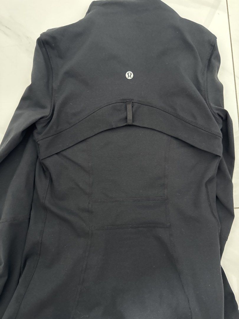Define jacket (Category: Coats, Jackets and Outerwear) located in Singapore. Submitted by needmoney4porsche (Listing ID 1458975512, Image 3). Description: - black jacket - Full zip closure but a bit difficult! - Two zippered front pockets - Thumbholes on sleeves - Lululemon logo on back - Suitable for workouts and casual wear.