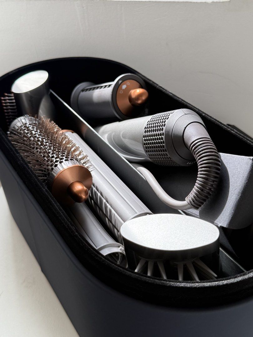 Dyson Airwrap (Category: Hair) located in Muntinlupa City. Submitted by aryansharmilla (Listing ID 1458894977, Image 1). Description: Dyson Airwrap Comes with box. 2 barrel for curls 1 brush 1 for flat hair Total 4 tools Just bought last december 2025 .