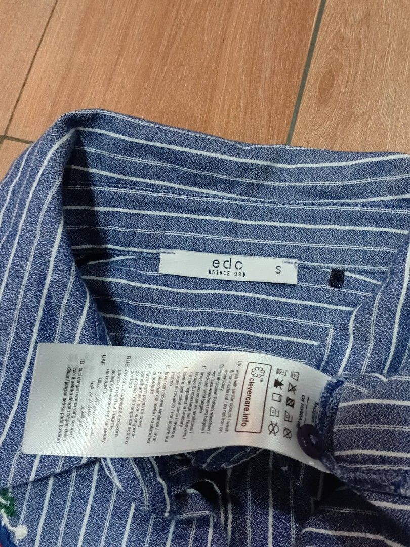 EDC by Esprit Striped Embroidered Button-Up Shirt Size S (Category: Shirts) located in Manila. Submitted by marleyjones49 (Listing ID 1458923670, Image 2). Description: - Blue and white striped button-up shirt - Features delicate floral embroidery on the front - Long sleeves - Brand: EDC by Esprit - Size: S -Width: 16 -Lenght: 25 - Ideal for casual outings and everyday wear.