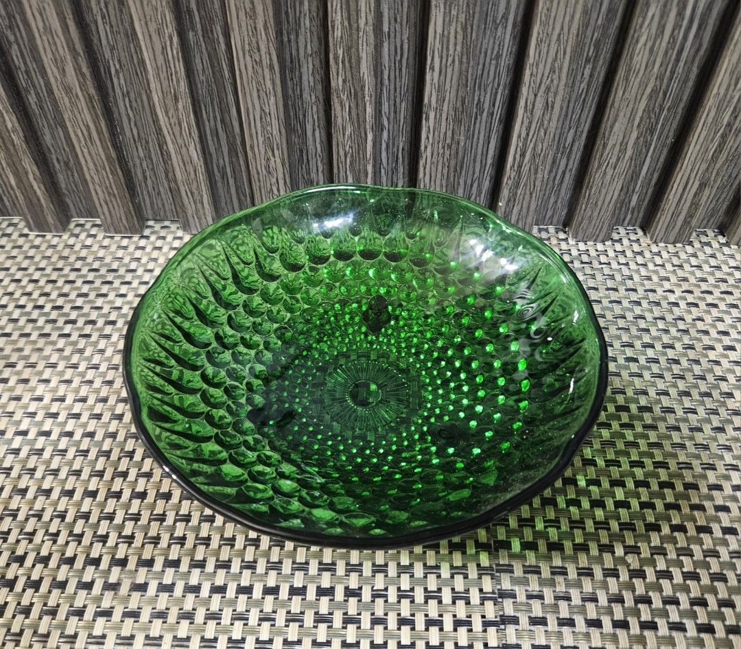 Emerald Green Glass Bowl with Embossed Pattern (Category: Other Kitchenware & Tableware) located in Rizal. Submitted by cherry_garcia (Listing ID 1458988924, Image 2). Description: - Beautiful emerald green glass bowl - Features a detailed embossed pattern all over - Scalloped edge rim - Measures approximately 6 inches in diameter - Stands about 2 inches in height - Ideal for serving snacks or as a decorative accent piece.