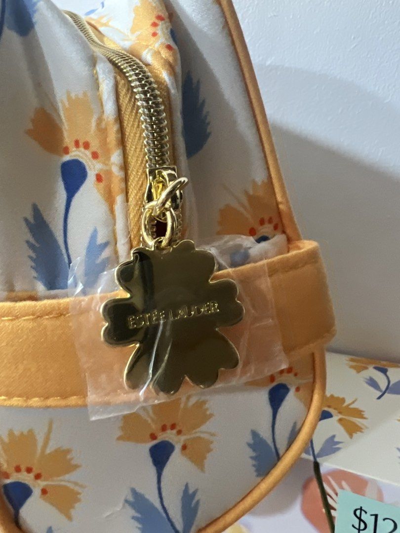 Estee Lauder Cosmetic Bag (Category: Makeup) located in Manila. Submitted by lunas_realm (Listing ID 1459069790, Image 3). Description: - Estee Lauder floral print cosmetic bag with a flower charm - Ideal for gifting or personal use.