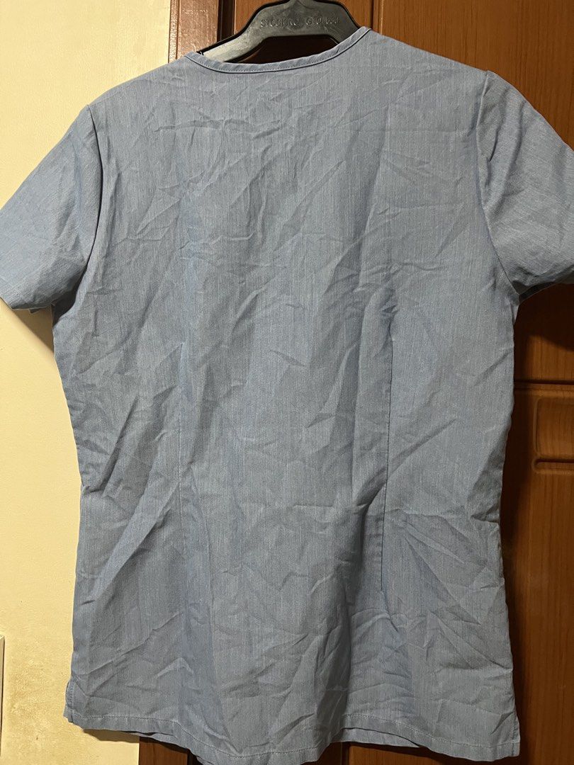 FIGS Blue Scrub Top - Brittany Dental Assistant (Category: Others Tops) located in Baguio. Submitted by kquizon1037 (Listing ID 1459009874, Image 2). Description: - Light blue FIGS scrub top - **FLAW** ‘Brittany Dental Assistant' embroidered on chest - Two front pockets - Short sleeves - Comfortable material for work - Perfect for dental professionals or vet techs.