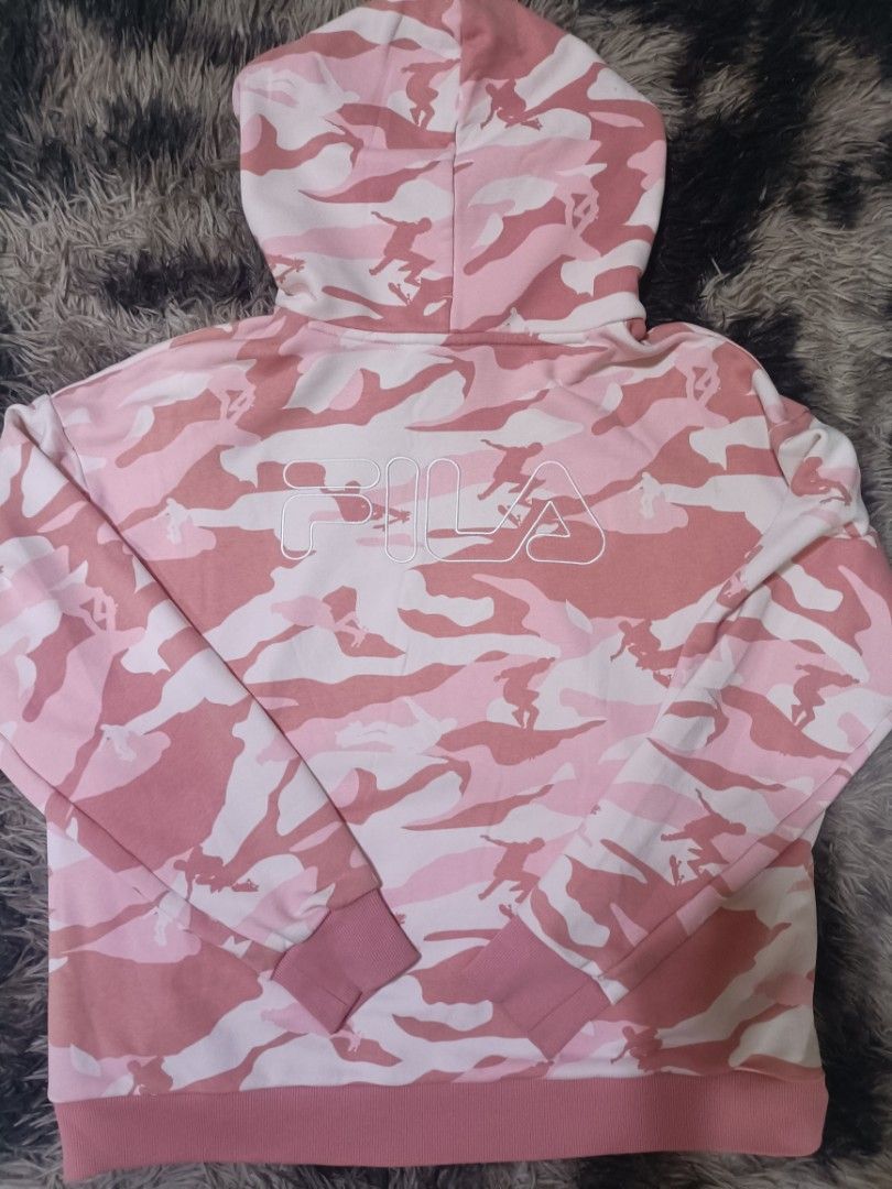 Fila Pink Camo Hoodie (Category: Coats, Jackets and Outerwear) located in Balanga. Submitted by emmandiwa (Listing ID 1458974472, Image 2). Description: - Trendy pink camouflage Fila hoodie - Iconic Fila logo on the chest - Large Fila graphic design on the back - Made from soft, comfortable material - Features a drawstring hood and ribbed cuffs - Ideal for casual and everyday wear - Refer to label for specific care instructions -- -Width 25 -Leng