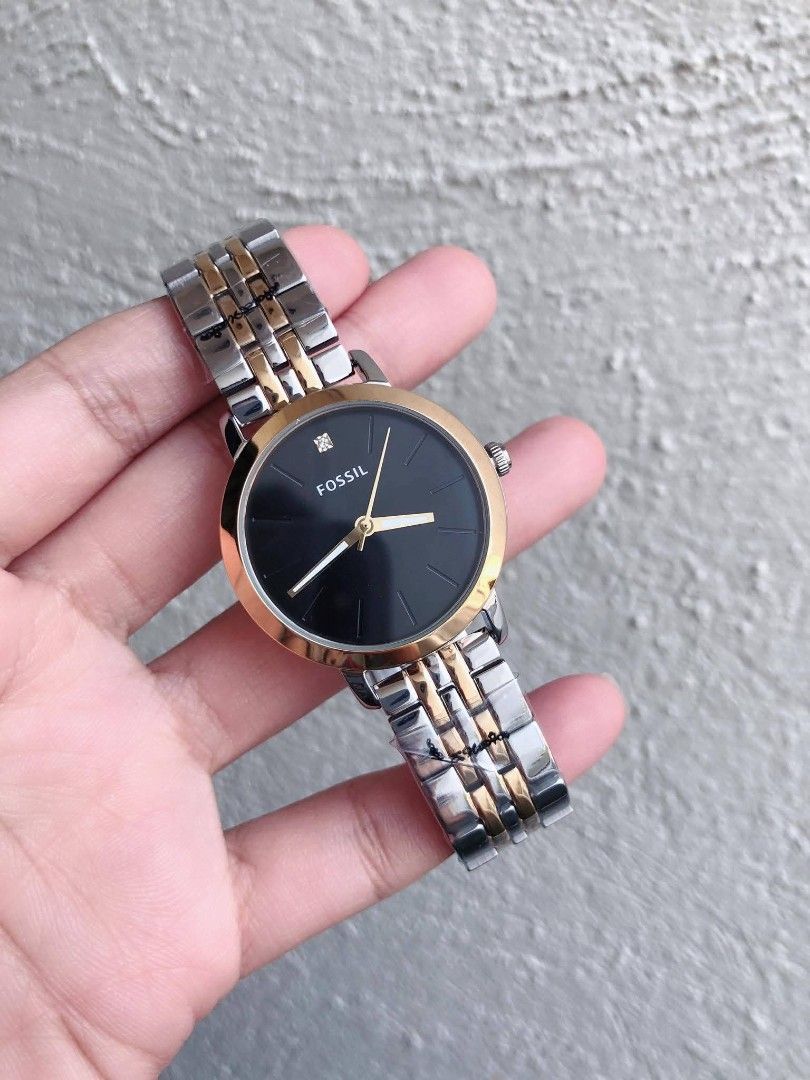 Fossil His & Her Lux Luther Two Tone (Category: Women's Watches) located in Las Pinas. Submitted by luxlahvu2017 (Listing ID 1458981615, Image 2). Description: - Set of two Fossil watches, perfect for couples. - Elegant black dial with gold-tone hands and markers. - Stylish two-tone silver and gold watch bands. - One watch is slightly larger, designed for a coordinated look..