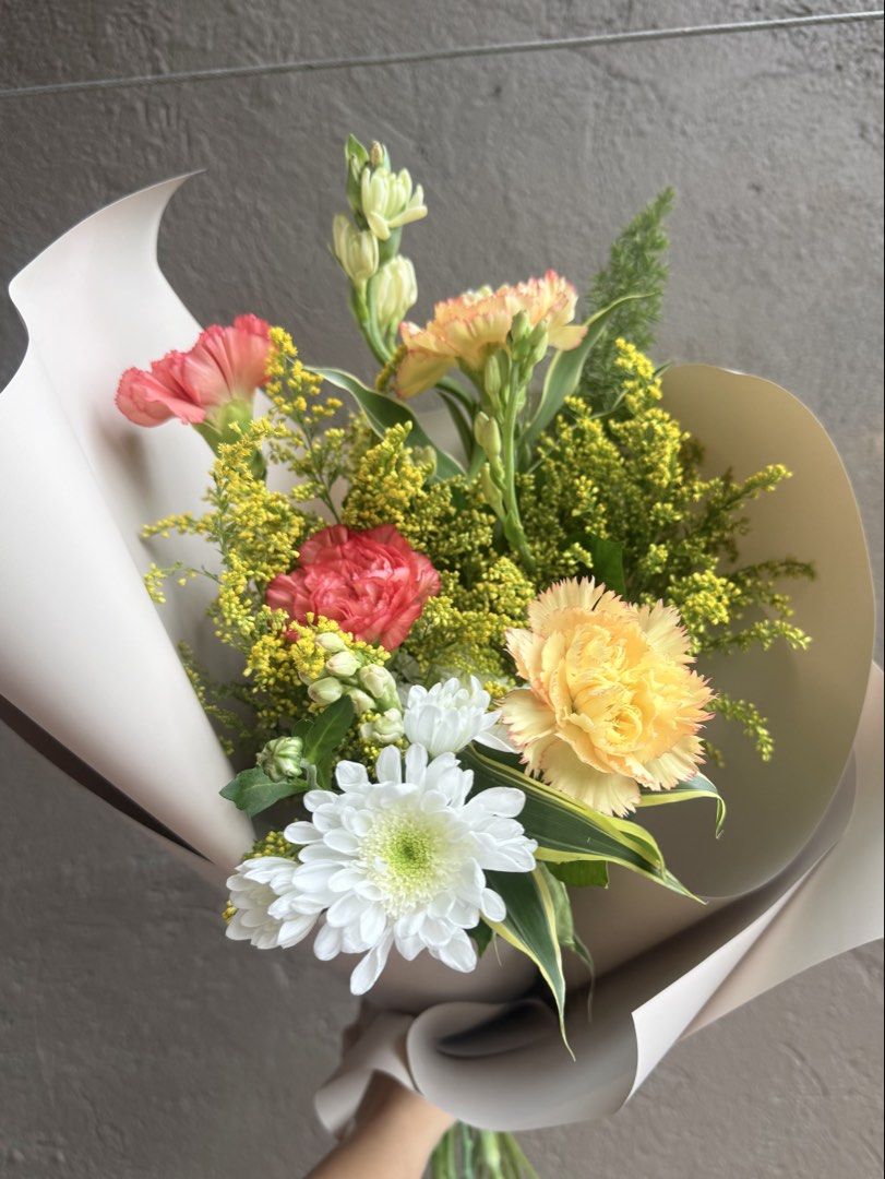 Fresh Mixed Flower Bouquet - Small Size (Category: Flowers & Bouquets) located in Calamba. Submitted by danecingreyna (Listing ID 1459020993, Image 2). Description: - Beautiful mixed flower bouquet - Features bright colored flowers (will include yellow, orange, red, and greenery) - Wrapped in a premium korean floral wrapper - Ideal for gifts or home decoration - Freshly arranged - For pick-up only - Free delivery within Cabuyao, Calamba, Sta Rosa