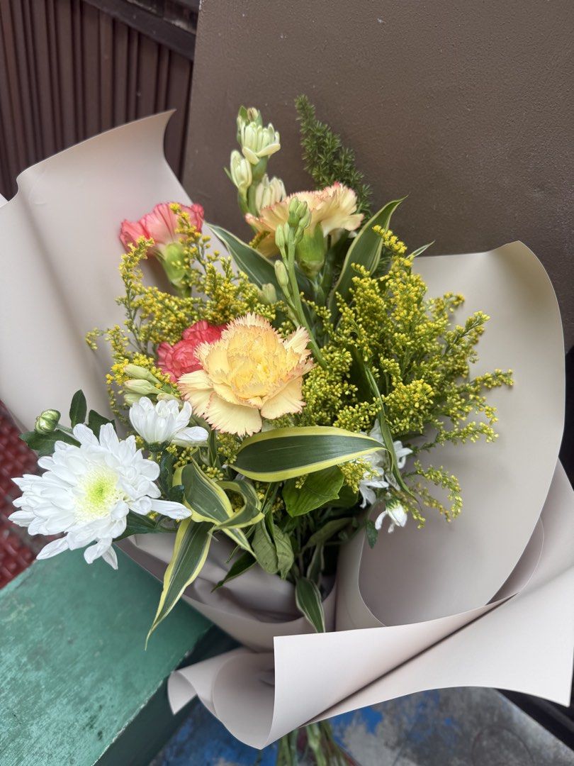 Fresh Mixed Flower Bouquet - Small Size (Category: Flowers & Bouquets) located in Calamba. Submitted by danecingreyna (Listing ID 1459020993, Image 3). Description: - Beautiful mixed flower bouquet - Features bright colored flowers (will include yellow, orange, red, and greenery) - Wrapped in a premium korean floral wrapper - Ideal for gifts or home decoration - Freshly arranged - For pick-up only - Free delivery within Cabuyao, Calamba, Sta Rosa
