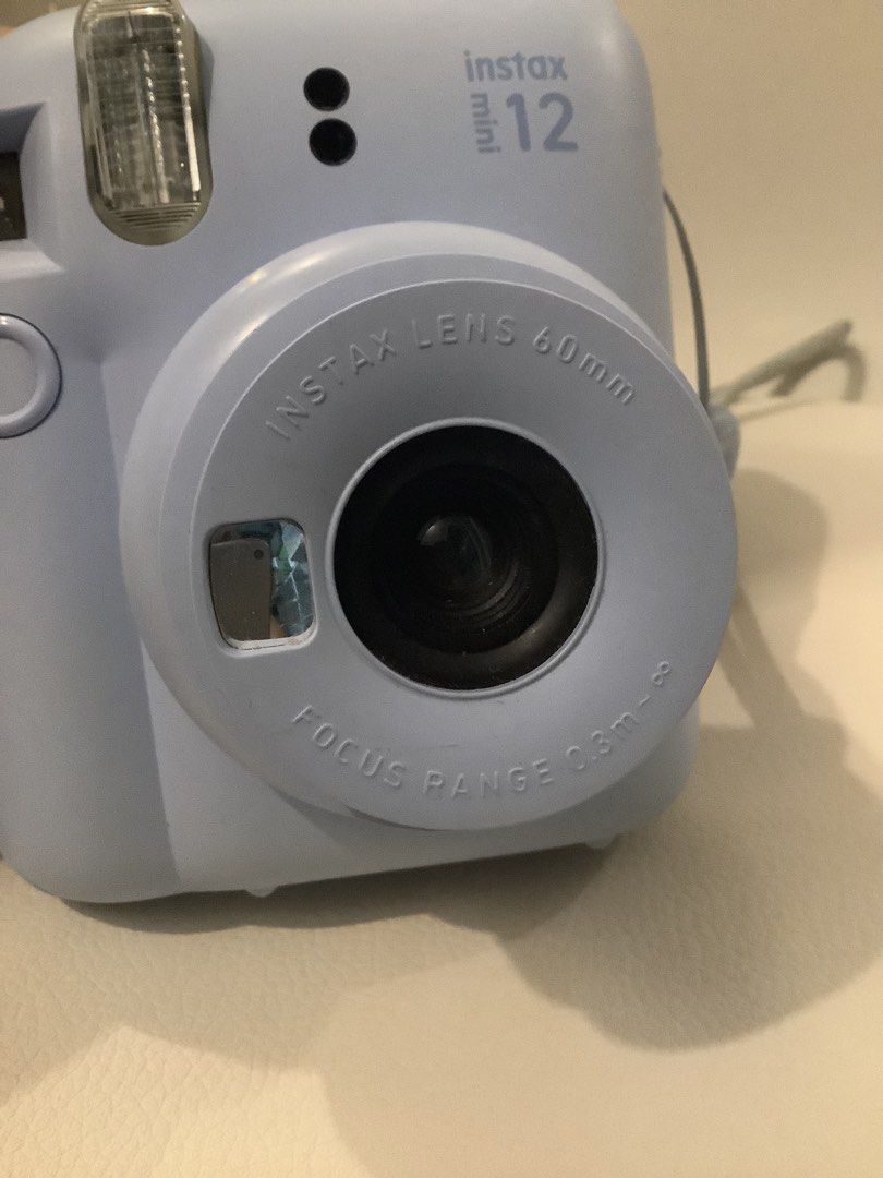 Fujifilm Instax Mini 12 Light Blue Instant Camera (Category: Cameras) located in Calamba. Submitted by keeprees (Listing ID 1458994295, Image 3). Description: - Fujifilm Instax Mini 12 Camera - Color: Light Blue - Ideal for instant, fun photos - Comes with a strap and clear case -No box but with Manual RFS: Upgrading to Evo .