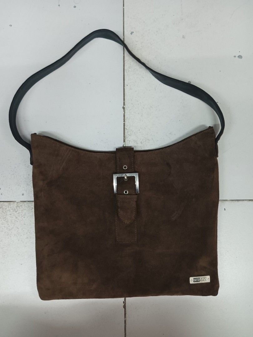 Gavin Studio Brown Suede Shoulder Bag with Buckle (Category: Shoulder Bags) located in Quezon City. Submitted by arvietekto (Listing ID 1458902650, Image 1). Description: - Brown suede shoulder bag from Gavin Studio - Classic design with a silver buckle closure on the front flap - Black strap - Black fabric interior lining - Ideal for everyday use.