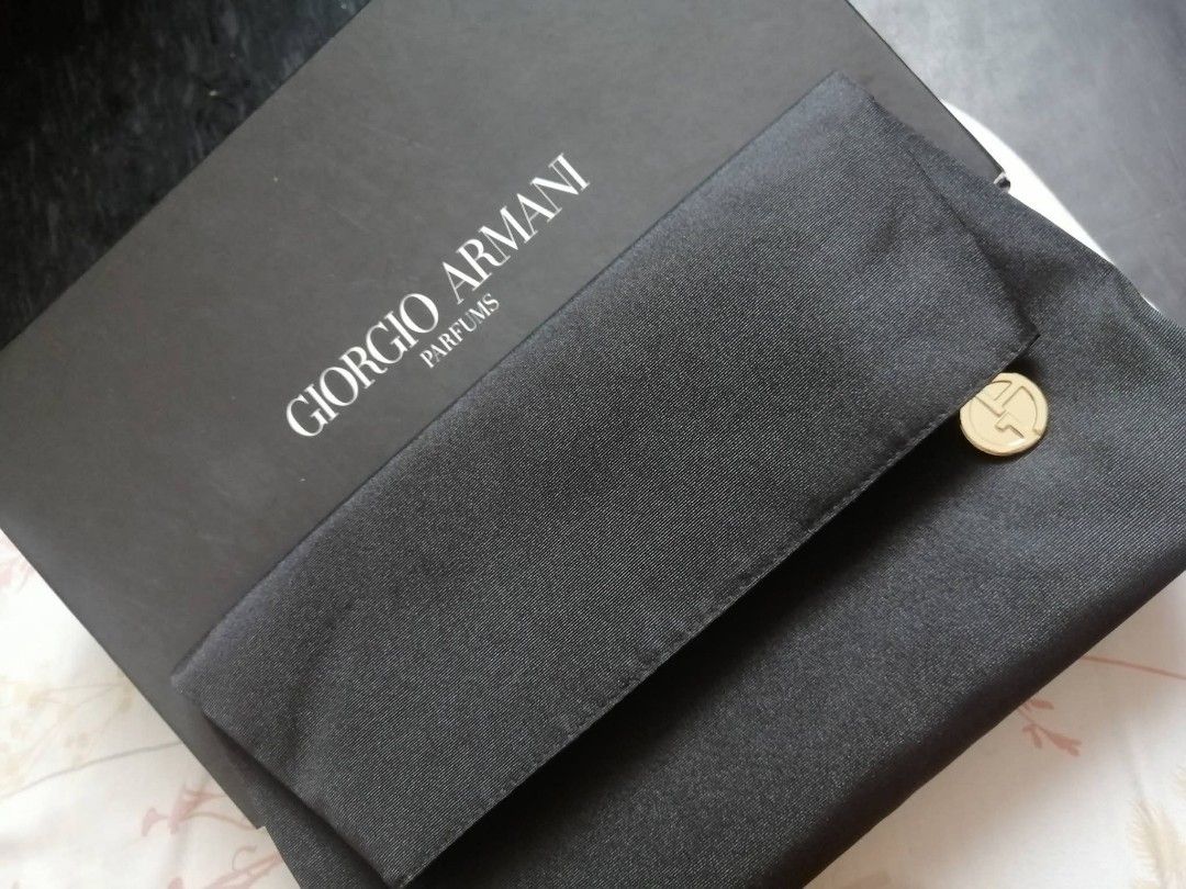 Giorgio Armani Parfums Box and Pouch (Category: Luxury Bags & Wallets) located in Manila. Submitted by roseannlmn66895 (Listing ID 1459068706, Image 1). Description: - Original Giorgio Armani Parfums packaging - Includes black box - Comes with a black satin pouch - Pouch features iconic GA logo charm - Ideal for perfume storage or as a gift set.