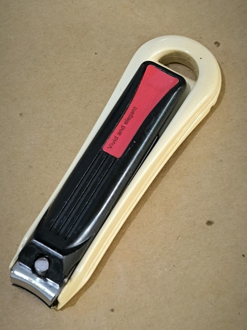 Green Bell Nail Clipper with Protective Catcher Guard (Category: Hands & Nails) located in Angeles City. Submitted by yellowbrickstore (Listing ID 1458959956, Image 2). Description: - Genuine Green Bell nail clippers made in Japan - Includes a beige protective case with hanging loop - Durable metal clippers with a comfortable black handle and red accent - Perfect for everyday personal grooming - Cleaned and ready for immediate use.