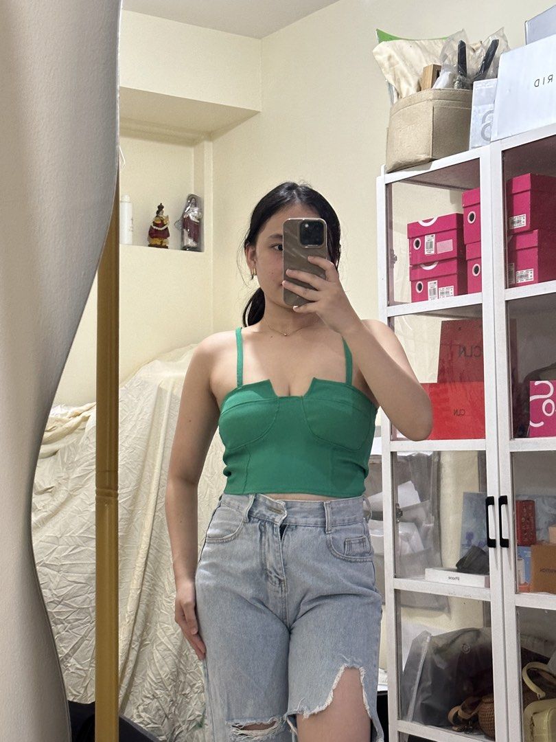 Green V-Neck Corset Crop Top (Category: Others Tops) located in Manila. Submitted by kathsclosetmnl (Listing ID 1459040228, Image 1). Description: - Cute green corset-style crop top - Adjustable straps for a perfect fit - Flattering V-neckline - Pairs well with high-waisted jeans or skirts - Ideal for nights out or casual wear.