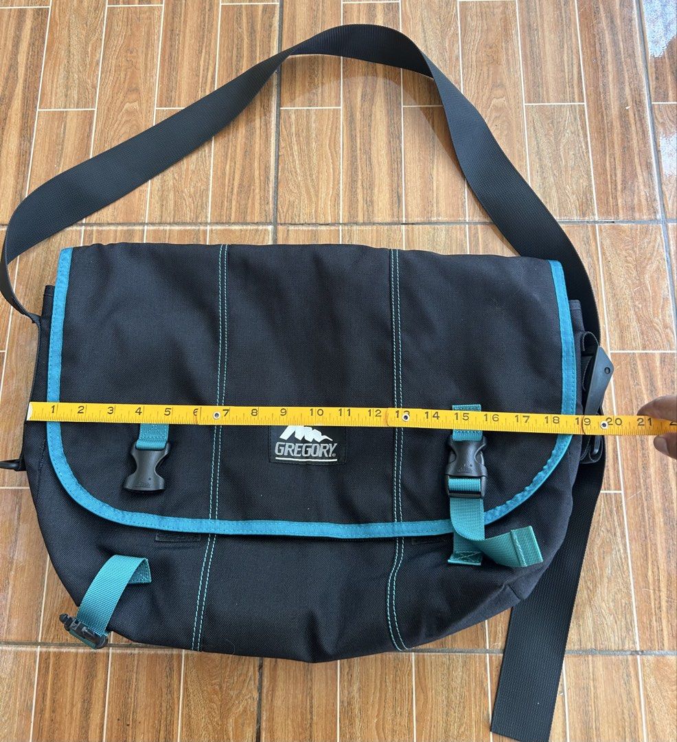 Gregory Messenger Bag Black Teal Accents (Category: Sling Bags) located in Cagayan de Oro. Submitted by aljay02 (Listing ID 1458953035, Image 3). Description: - Brand: Gregory - Color: Black with teal accents - Closure: Two buckle closures on front flap - Strap: Adjustable shoulder strap - Dimensions: Approximately 19 inches wide x 14 inches tall - Ideal for: Everyday use or travel.
