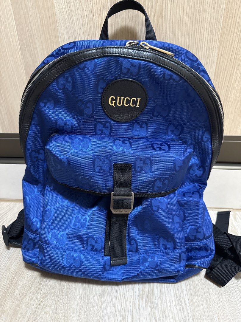 Gucci Polyester Backpack Blue Monogram Pattern (Category: Bags & Wallets) located in Singapore. Submitted by tweety3334 (Listing ID 1459042875, Image 1). Description: - Authentic Blue Gucci Backpack - All-over GG Monogram Pattern - Black Leather Trim and Straps - Front Pocket with Buckle Closure - Zippered Main Compartment - Adjustable Shoulder Straps - Ideal for Everyday Use or Travel Height 30cm Width 25cm Come with dust bag.