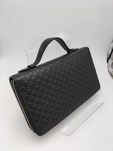 GUCCI TRAVEL DOCUMENT CASE GUCCISSIMA BLACK LEATHER (Category: Luxury Bags & Wallets) located in Pasig City. Submitted by vetementsdemanila (Listing ID 1458998985, Image 2). Description: GUCCI TRAVEL DOCUMENT CASE GUCCISSIMA BLACK LEATHER Good as new 9.5/10 No dustbag/ box Guaranteed authentic P24,500 REGULAR PRICE P19,500 SALE PRICE.