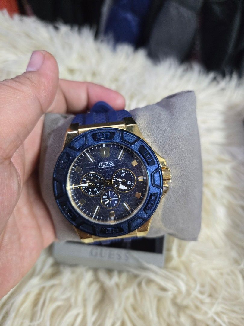 Guess force men's multifunction quartz watch (Category: Men's Watches) located in Quezon City. Submitted by bags4ever (Listing ID 1458959251, Image 1). Description: Key Features & Specifications Design: Bold sporty aesthetic combining a yellow gold-tone stainless steel case with a fixed textured blue bezel. Dial: Dark blue textured dial featuring three multi-function subdials that track the day of the week, date, and 24-hour time. Strap: Integrat