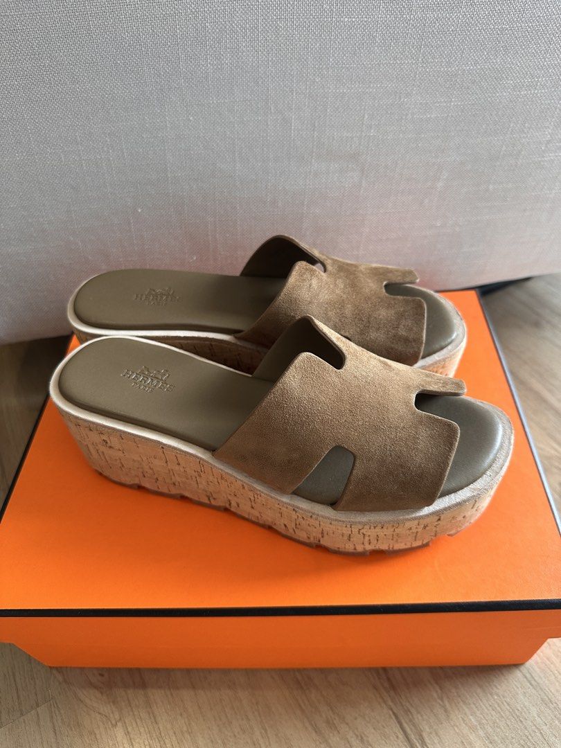 H Eze 30 Sandals size 38 (Category: Flats & Sandals) located in Quezon City. Submitted by clothesrack24 (Listing ID 1458937501, Image 1). Description: Used twice only - H EZE 30 wedge sandals in suede beige - Color: Suede Terre Ambree - like dark toupe - Cork wedge sole - Iconic H strap design - Includes H dust bags and box - Made in Spain stamp - Super comfortable and stylish.