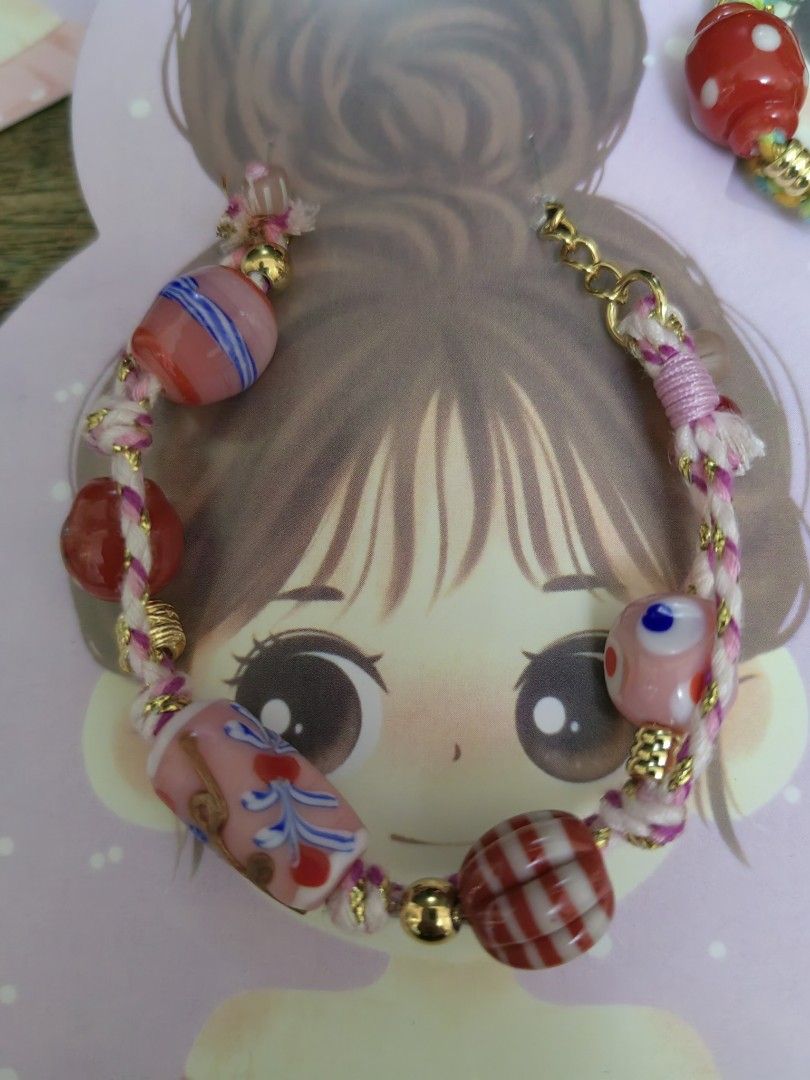 Handmade Beaded Bracelet with Charms (Category: Bracelets) located in Davao. Submitted by gelleevanelli (Listing ID 1459023787, Image 3). Description: - Cute handmade boho bracelets - Colorful beads and unique charms - Strung on braided cord - Adds a pop of color to any outfit - Great for gifting or treating yourself - Available for sale individually or as a set.