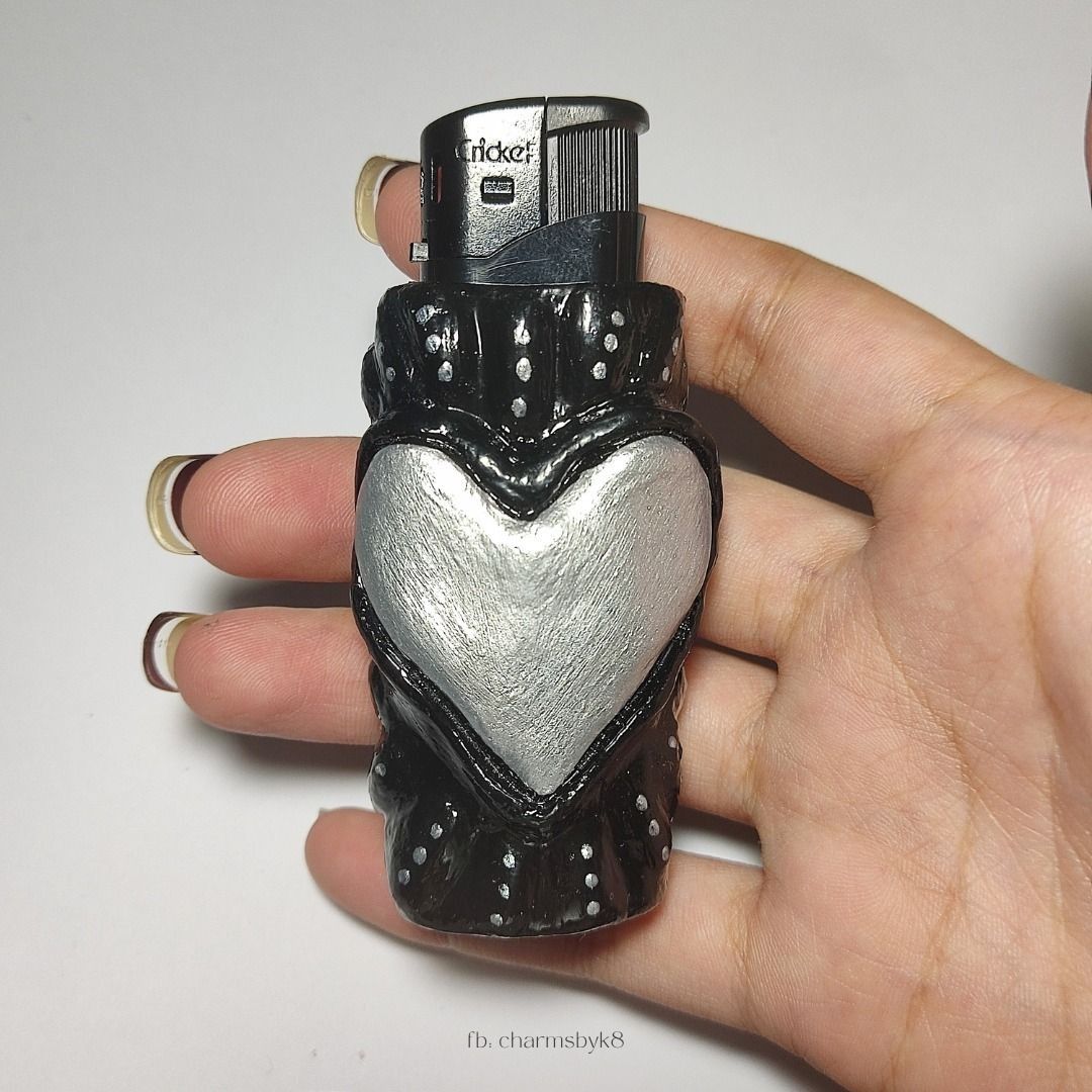 Handmade Black and Silver Heart Clay Lighter Case (Category: Handmade Craft) located in Bacoor. Submitted by kmrynl (Listing ID 1458965794, Image 2). Description: handcrafted clay lighter case by me! - lighter is included :) - accepting custom orders, dm for inquiries (price starts at 310) check out my socials to see more available items ♡ FB & IG: charmsbyk8 [tags: anik anik, clay keychain, y2k, grunge, heart, lighter case, handmade] MOP: BPI/Ma