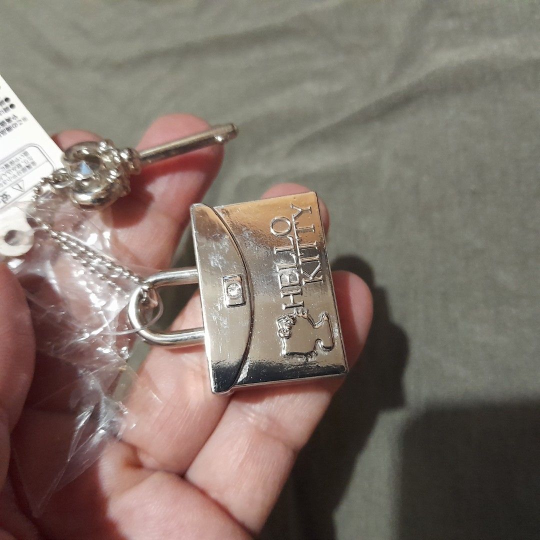 Hello Kitty Lock and Key Keychain (Category: Character Goods) located in Bocaue. Submitted by marajapansurplus (Listing ID 1458955808, Image 3). Description: - Adorable Kitty lock and key design - Silver tone metal finish - Brand new with original tags - Never used, still in packaging - Ideal for decorating bags or as a collectible item.