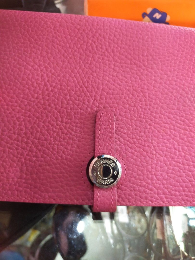 Hermes Pink Leather Wallet 💯%Original (Category: Luxury Bags & Wallets) located in Manila. Submitted by new-opening (Listing ID 1458907316, Image 2). Description: - Authentic Hermes pink leather wallet - Made in France - Snap closure - Interior card slots - Includes separate zippered pouch - Classic design, ideal for everyday use riri,M4 at the back of zipper. .