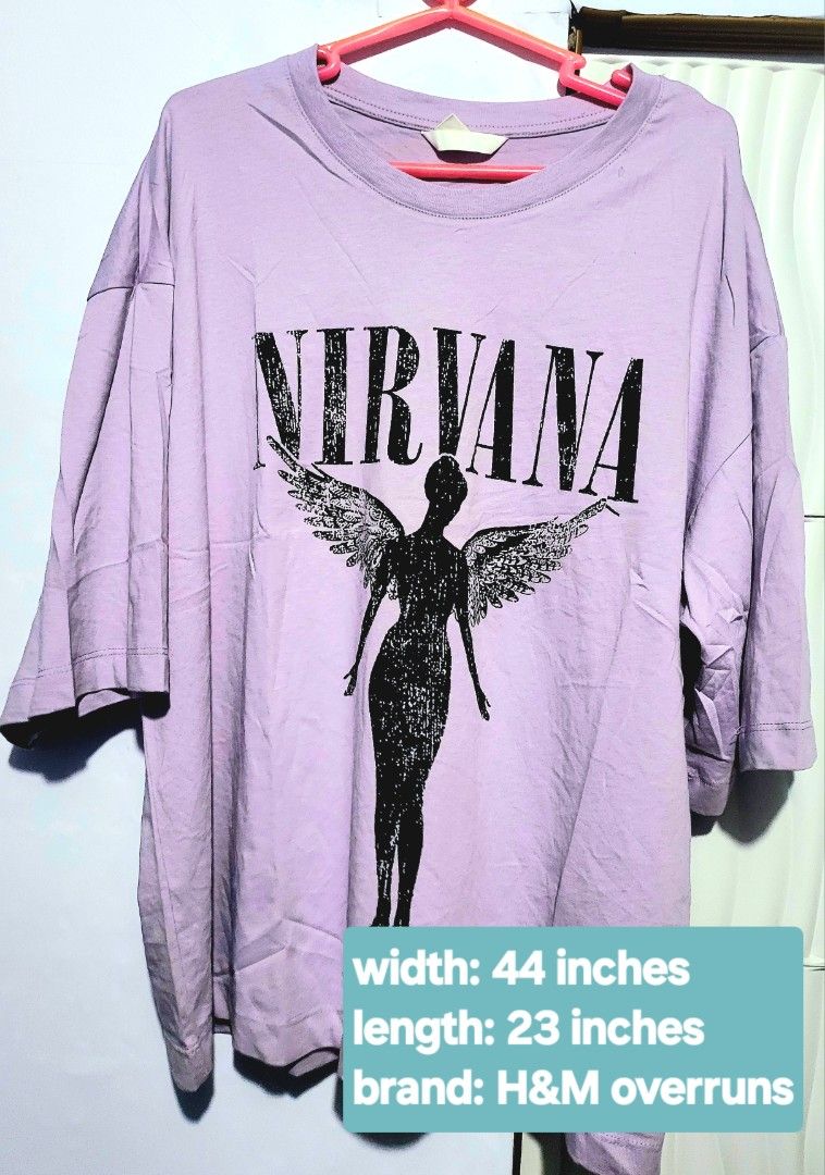 H&M Overruns Nirvana Graphic T-shirt (Category: Shirts) located in Pasig City. Submitted by inigosdreamshop (Listing ID 1459084591, Image 1). Description: - Oversized lilac t-shirt - Features iconic Nirvana angel graphic - Brand: H&M (overruns) - Measurements: 44 inches width, 23 inches length - Comfortable and stylish - Ideal for Nirvana fans.