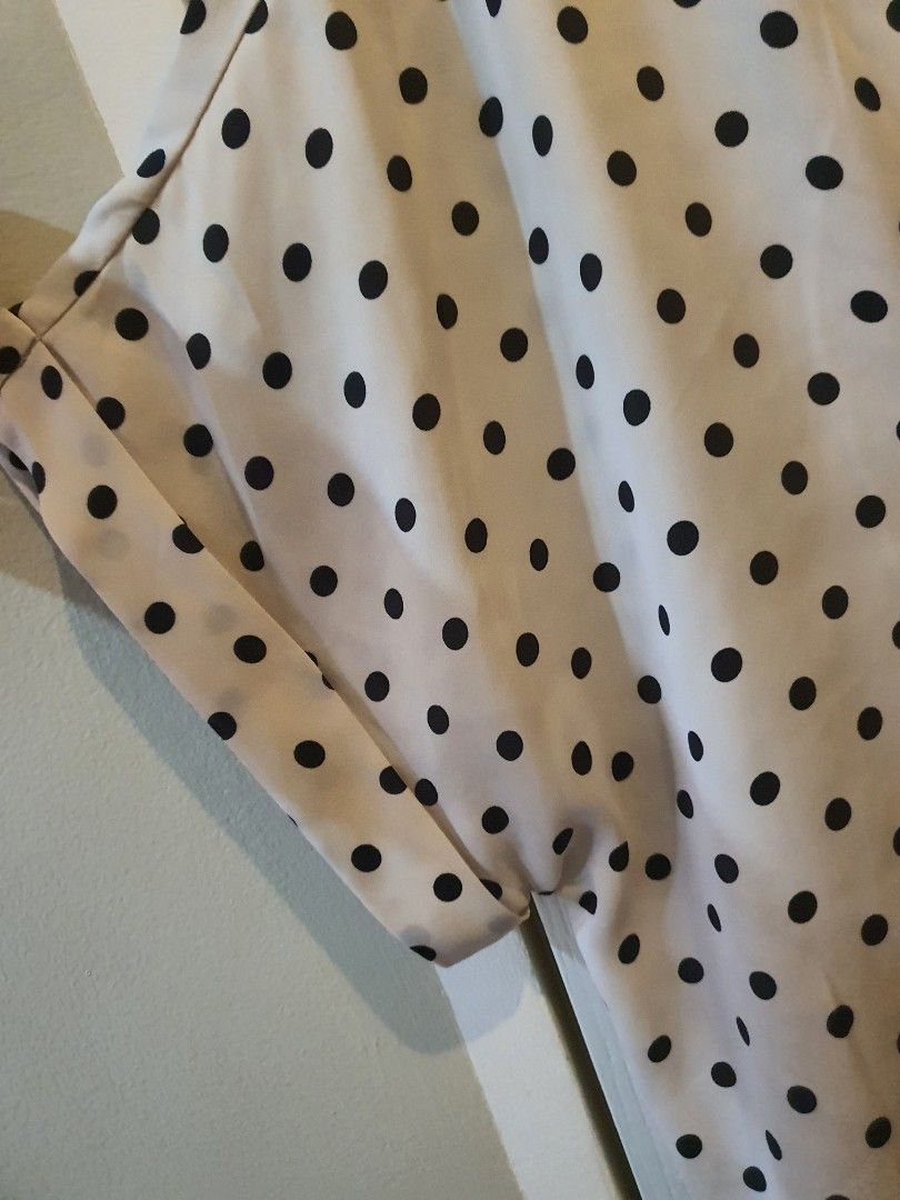 H&M Polka Dot Blouse (Category: Blouses) located in Quezon City. Submitted by RepeatOnFleek (Listing ID 1458917232, Image 3). Description: - Cream color blouse with classic black polka dots - Stylish keyhole detail at the back - Elegant cuffed sleeves - Brand: H&M - Tagged XS but fit from Medium to Large.