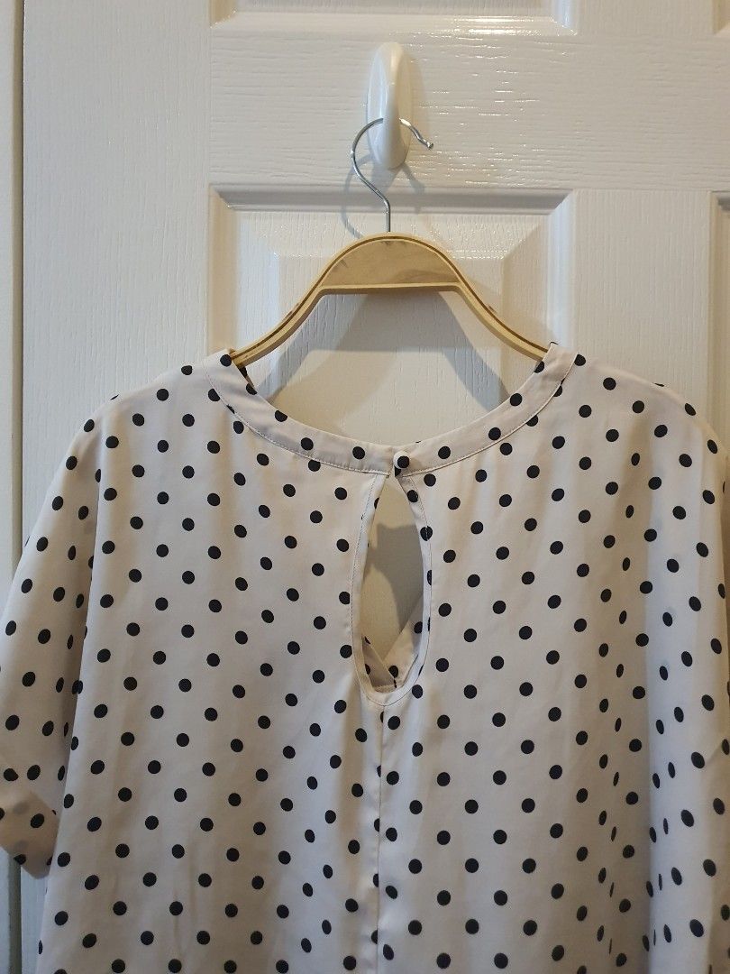 H&M Polka Dot Blouse (Category: Blouses) located in Quezon City. Submitted by RepeatOnFleek (Listing ID 1458917232, Image 2). Description: - Cream color blouse with classic black polka dots - Stylish keyhole detail at the back - Elegant cuffed sleeves - Brand: H&M - Tagged XS but fit from Medium to Large.