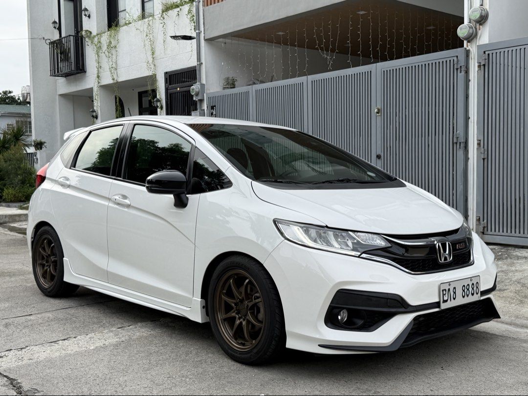 Honda Jazz 1.5 RS Hatchback (A) (Category: Used Cars) located in Bacoor. Submitted by datrc (Listing ID 1458979829, Image 2). Description: Honda Jazz RS 2019 Top of the Line Automatic Transmission w/ Paddle Shifters Taffeta White (Original Paint) 63k Original Mileage With Casa Records 8 Ending Plate Push Start Button Keyless Entry Cruise Control Navigation System Reverse Camera 2 Original Smart Keys New Rota Ce28 16s New Tires Yokohama Advan J’s 