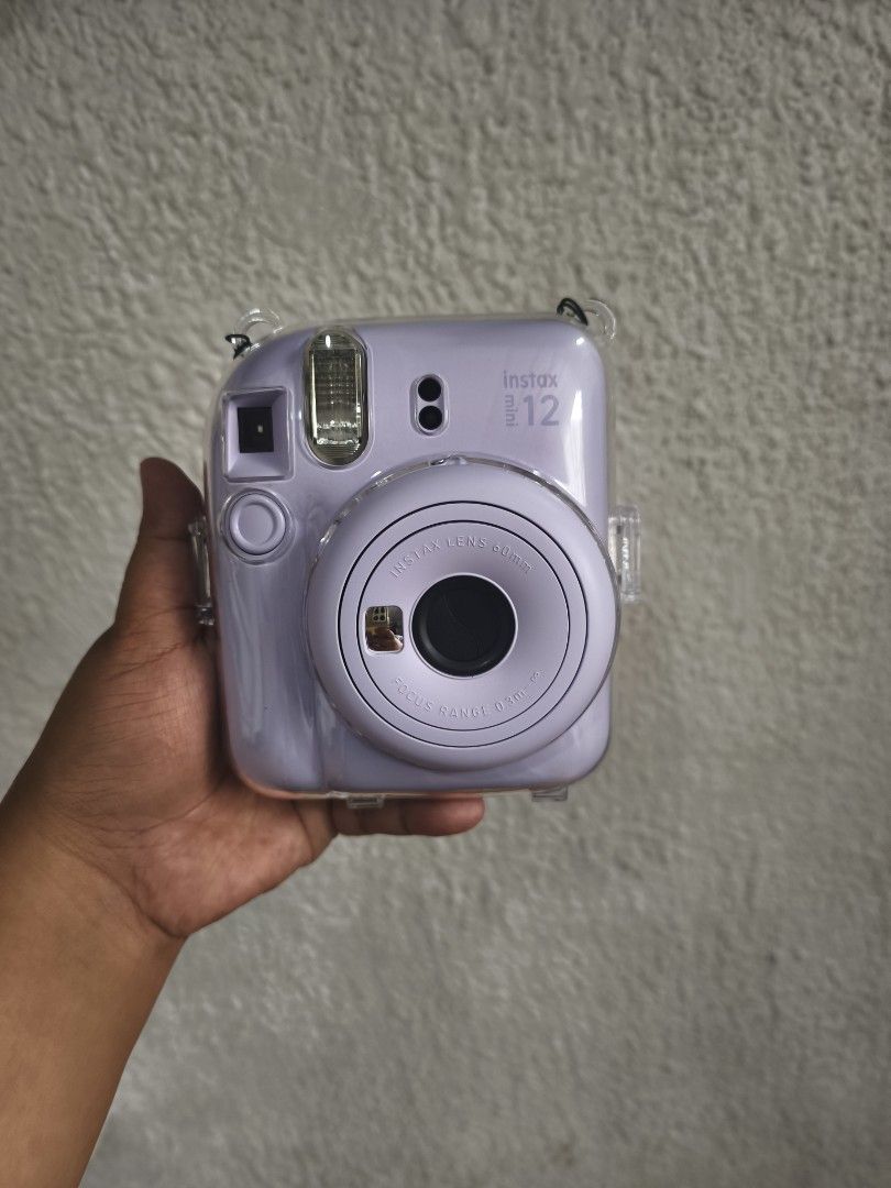 Instax Mini 12 with clear case and leather flannel case bag (Category: Cameras) located in Manila. Submitted by gracey.js (Listing ID 1459004284, Image 1). Description: FOR SALE: Fujifilm Instax Mini 12 📸 Used only 3 times 📸 Excellent condition 📸 Complete and well-maintained Inclusions: ✔ Clear Case ✔ Leather Flannel Bag ✔ FREE 8 pcs Film Payment Method: 💳 GCash or Bank Transfer only 📍 Cainta, Rizal 🚚 Shipping available (buyer shoulders shi