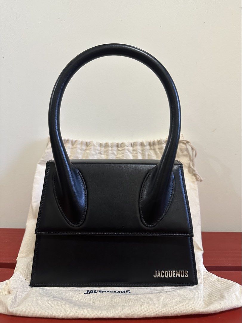 Jacquemus Le Grand Chiquito (Category: Luxury Bags & Wallets) located in Manila. Submitted by seancatubig (Listing ID 1458982206, Image 1). Description: - Authentic Black Jacquemus Bag - Used once - Genuine Leather Material - Iconic Top Handle Design - Compact Size, Big Statement - Includes Dust Bag and original unused strap - Ideal for Evenings or Elevating Outfits - Price is still negotiable .