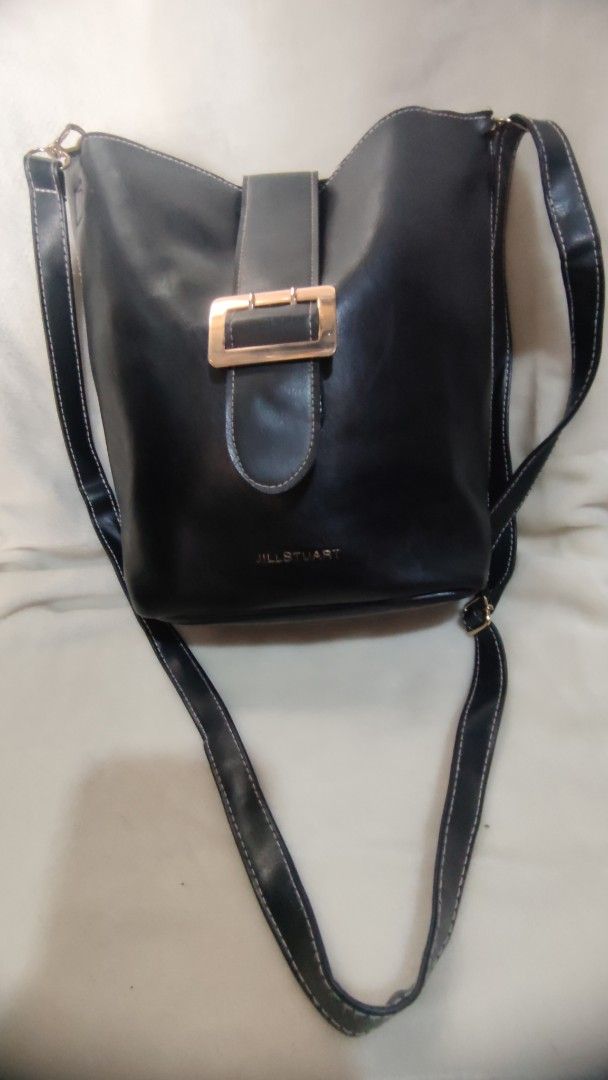 Jill Stuart Black Bucket Bag (Category: Luxury Bags & Wallets) located in Manila. Submitted by annetteasi22390 (Listing ID 1458951690, Image 2). Description: - Stylish black bucket bag - Elegant gold buckle detail - Versatile top handle and long strap - Secure magnetic closure - Ample interior space - Ideal for everyday use.