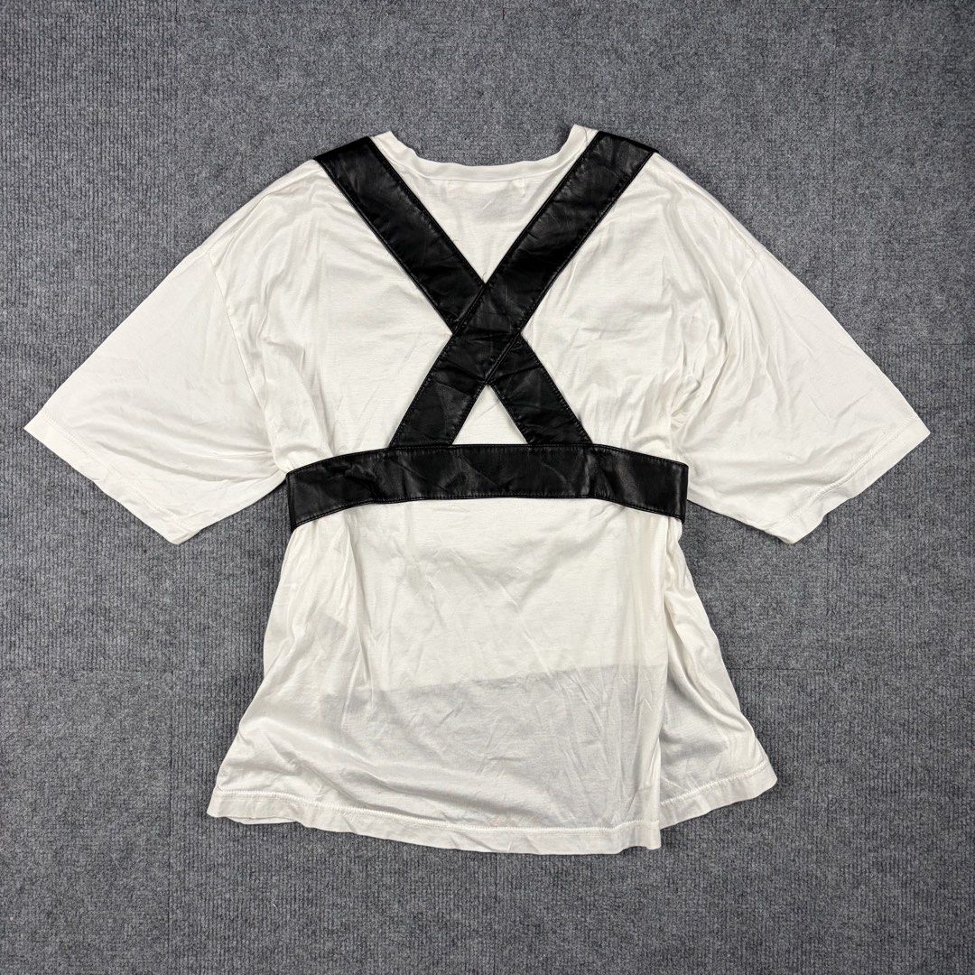 Junya Watanabe Comme des Garcons Avant-Garde Top (Category: Others Tops) located in Manila. Submitted by yourtherapist_ (Listing ID 1459084039, Image 2). Description: Junya Watanabe Comme des Garcons Avant-Garde Top Size: S Condition: 9/10 Material: 100% Cotton, Synthetic Leather Made in: Japan Measurements Width: 23 Front Length: 19 Back Length: 26 Shoulder: 21 Aesthetically weird top, oversized fit. It blends with classic punk streetwear and BD