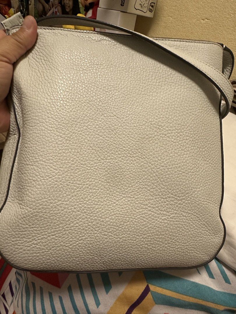 Kate Spade Grey Leather Crossbody Bag (Category: Cross-body Bags) located in Quezon City. Submitted by threerjs (Listing ID 1458933184, Image 2). Description: - Brand: Kate Spade - Material: Grey pebbled leather - Style: Crossbody bag - Features: Front zip pocket, adjustable strap - Design: Simple and classic - Ideal for: Everyday use - Interior: Plenty of space for essentials - Light Blue color.