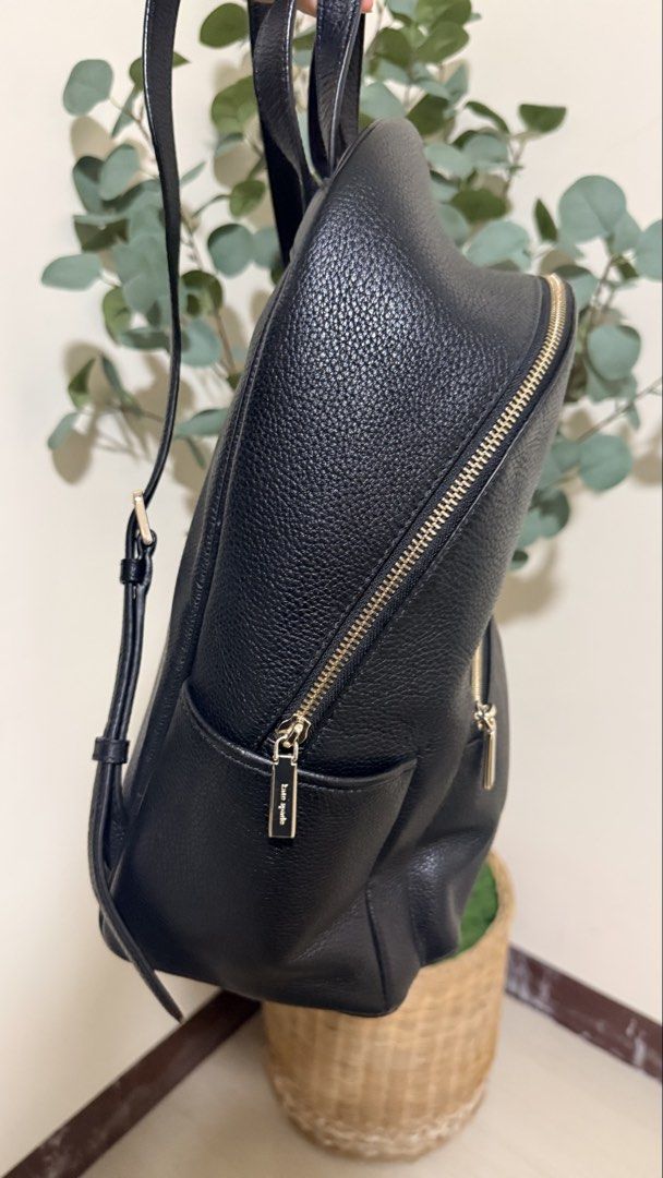 Kate Spade New York Black Leather Backpack (Category: Backpacks) located in Batangas. Submitted by etc.byflc (Listing ID 1458979078, Image 2). Description: 📍 Batangas 📌 Payment first, no COD 🛵🚚 Shipping via J&T or LBC 📩 for inquiries -Authentic, personal preloved - Classic black pebbled leather backpack from Kate Spade New York. - Elegant gold-tone hardware. - Multiple zip pockets for secure storage and organization. - Branded interior linin