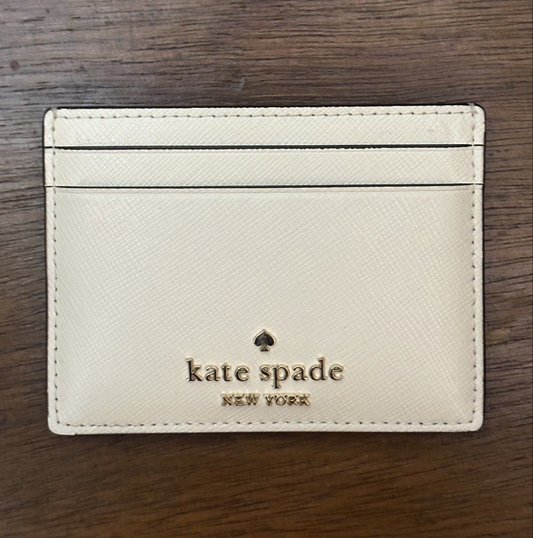 Kate Spade Slim Card Holder Wallet (White) (Category: Wallets & Card holders) located in Manila. Submitted by rystuffs (Listing ID 1458929354, Image 1). Description: - ORIGINAL, bought in Taiwan - Good condition - Bought for 4,500 - RFS: declutter .