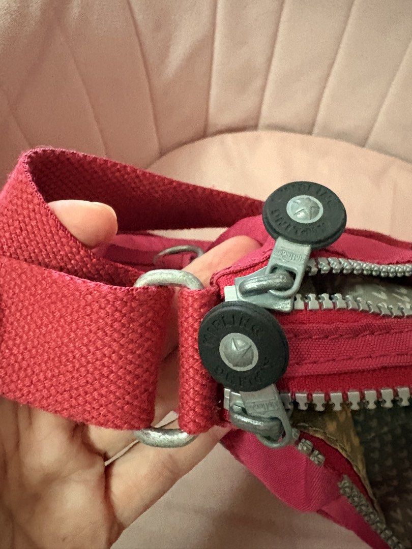 Kipling Red Nylon Crossbody Bag with Multiple Zips (Category: Cross-body Bags) located in Paranaque City. Submitted by aihp20 (Listing ID 1458923513, Image 2). Description: - Authentic Red Kipling Crossbody Bag - Durable Nylon Material - Three Zippered Compartments on the Front - Adjustable Strap with Metal Hardware - Kipling Logo Zipper Pulls - Ideal for Everyday Use - Spacious Enough for Your Essentials.