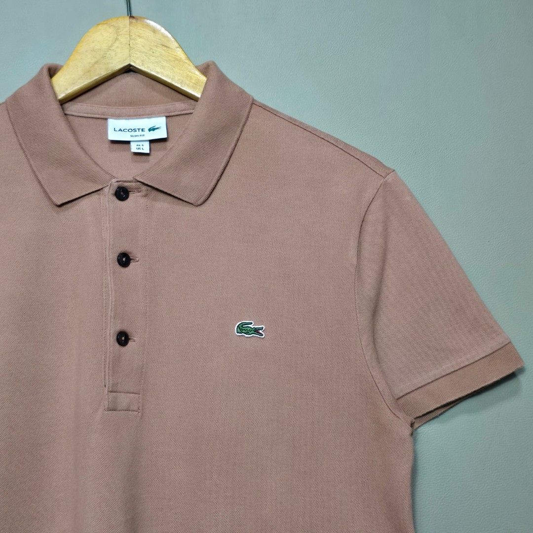 Lacoste Mocha Polo Shirt (Category: Tshirts & Polo Shirts ) located in Manila. Submitted by thrift-finds.ph (Listing ID 1458967140, Image 3). Description: Lacoste Mocha Polo Shirt - Size: 5/Large (Slim Fit) Fits Medium - Dimension: 20 W" x 27 L" - Excellent Condition - Color rate: 9.8/10 - No Issues - Color may vary due to lighting 📸.