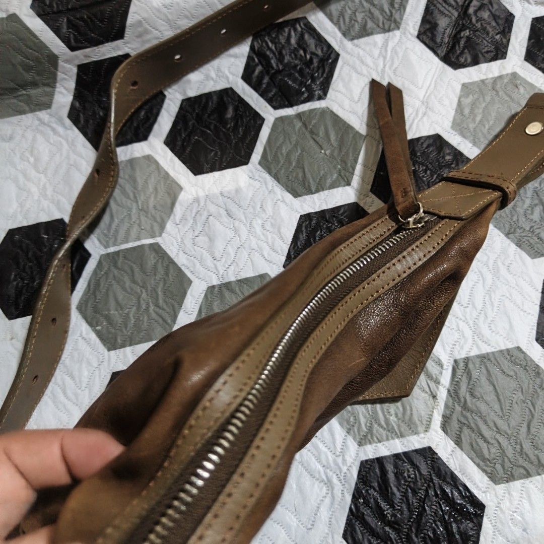 LAMPAS Brown Leather Shoulder Bag (Category: Shoulder Bags) located in Manila. Submitted by narju1234 (Listing ID 1459018616, Image 2). Description: - Brand: LAMPAS - Material: Brown Leather - Style: Soft, slouchy shoulder bag - Closure: Zipper - Strap: Adjustable - Interior: Fabric lining - Condition: Signs of wear on leather, giving a vintage look - Ideal for: Everyday use.