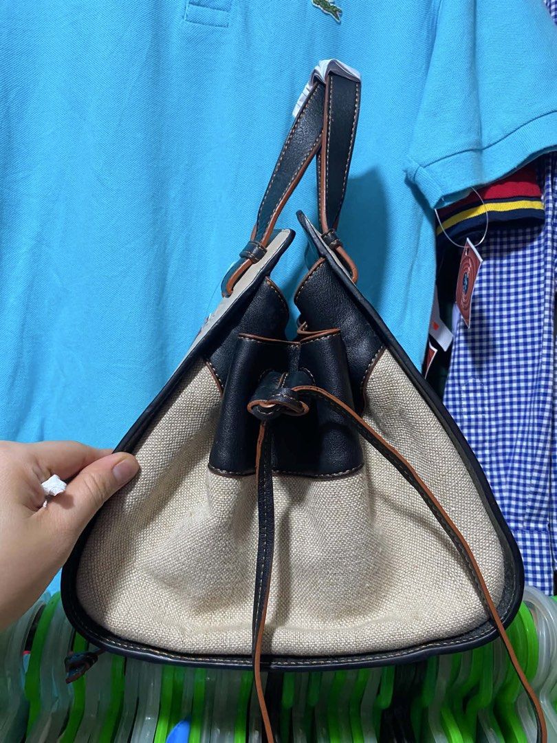 Loewe (Category: Luxury Bags & Wallets) located in Quezon City. Submitted by retann (Listing ID 1458891055, Image 3). Description: - Authentic hammock handbag small in size - Combination of durable canvas and premium leather - Stylish neutral beige and black colorway - Secure drawstring closure on the sides - Comfortable top handles with leather trim - Ideal for everyday use, carrying all your essentials.