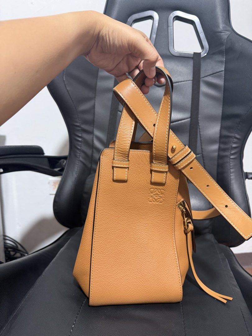 Loewe Hammock Bag Tan Leather (Category: Luxury Bags & Wallets) located in Antipolo. Submitted by declutteringirlie0317 (Listing ID 1459045204, Image 1). Description: - Loewe Hammock Bag - Color: Tan Leather - Carry Options: Handheld or Shoulder Bag - Material: Pebbled Leather Texture - Hardware: Gold - Style: Classic, Versatile Everyday Bag -lost auth card/misplaced -with dustbag -bought from Japan seller.