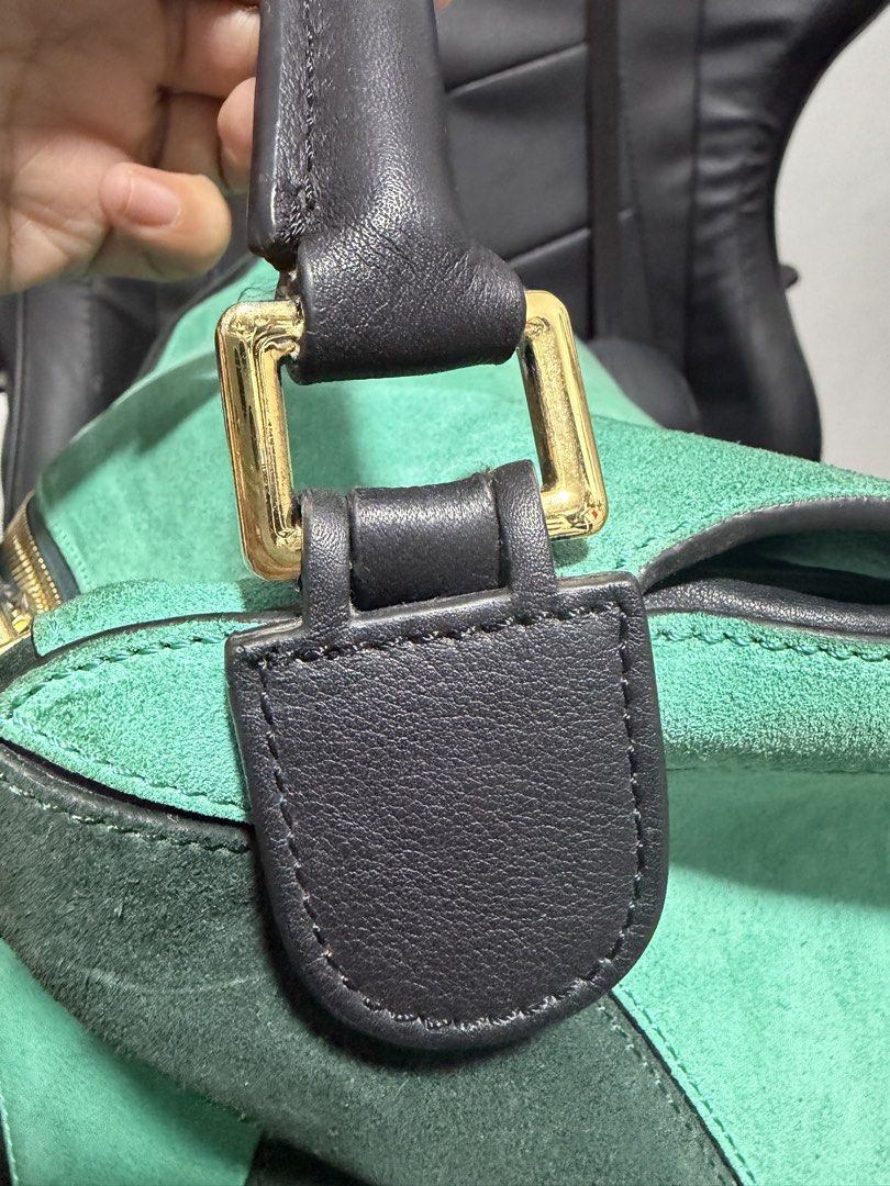 Loewe Puzzle Bag Green Suede Leather (Category: Luxury Bags & Wallets) located in Antipolo. Submitted by declutteringirlie0317 (Listing ID 1459012938, Image 3). Description: - Loewe bag in green suede and black leather - Features iconic Loewe anagram hardware - Includes a detachable shoulder strap - Interior is clean - A stylish and versatile addition to your collection -Large size perfect for travels -minimal discoloration in gold hardware due t