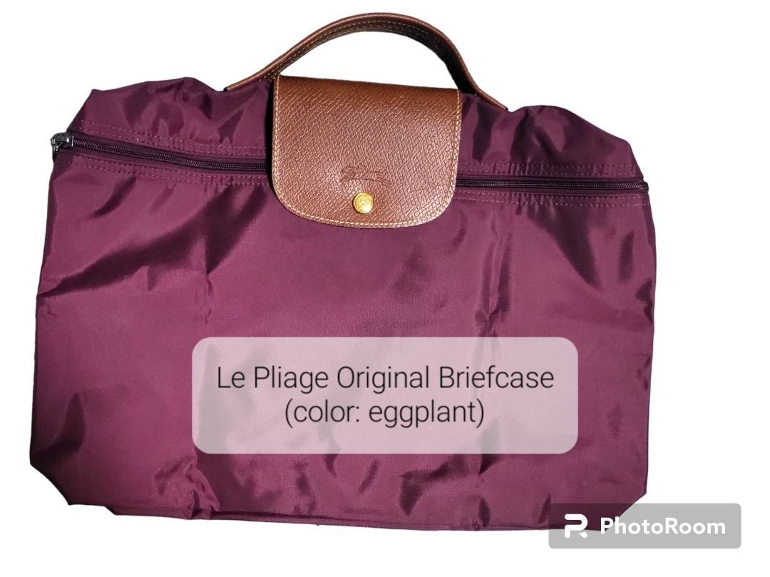 Longchamp Le Pliage Original Briefcase - Eggplant (Category: Luxury Bags & Wallets) located in Taytay. Submitted by Saturday_Mornings (Listing ID 1458934180, Image 2). Description: - Authentic Longchamp Le Pliage Original Briefcase - Color: Eggplant - Dimensions: 28 x 37 x 8 cm - Lightweight: 190g - Secure zipper closure - Features leather handles and flap detail - Ideal for everyday use or travel Material : Polyamide canvas with inside coating M