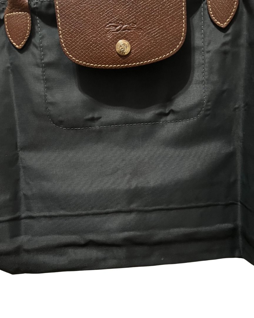 Longchamp Le Pliage Tote Bag (Large) (Category: Shoulder Bags) located in Las Pinas. Submitted by rawrmona (Listing ID 1459020017, Image 3). Description: Color: Navy/Greyish Blue Issue: Bubbles are evident on the bag - Very loved.