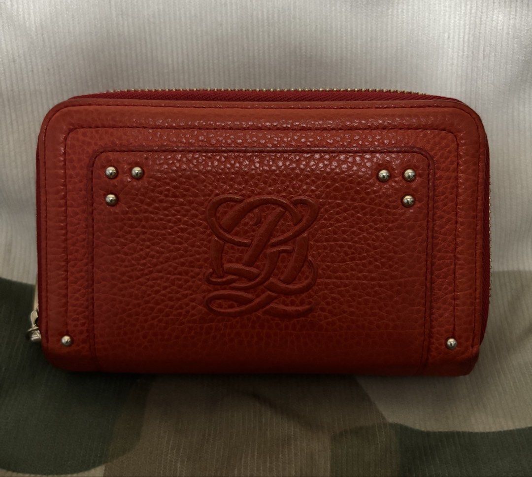 Louis Quatorze Red Leather Zip Around Wallet (Category: Wallets & Card holders) located in Naga. Submitted by taurusg (Listing ID 1458894233, Image 1). Description: - Authentic Louis Quatorze orange red leather wallet - Secure zip-around closure - Multiple card slots and clear ID window - Convenient coin pocket with snap closure - Minor marks on the exterior back - Zippers are in smooth working condition - Medium size -ykk zip .