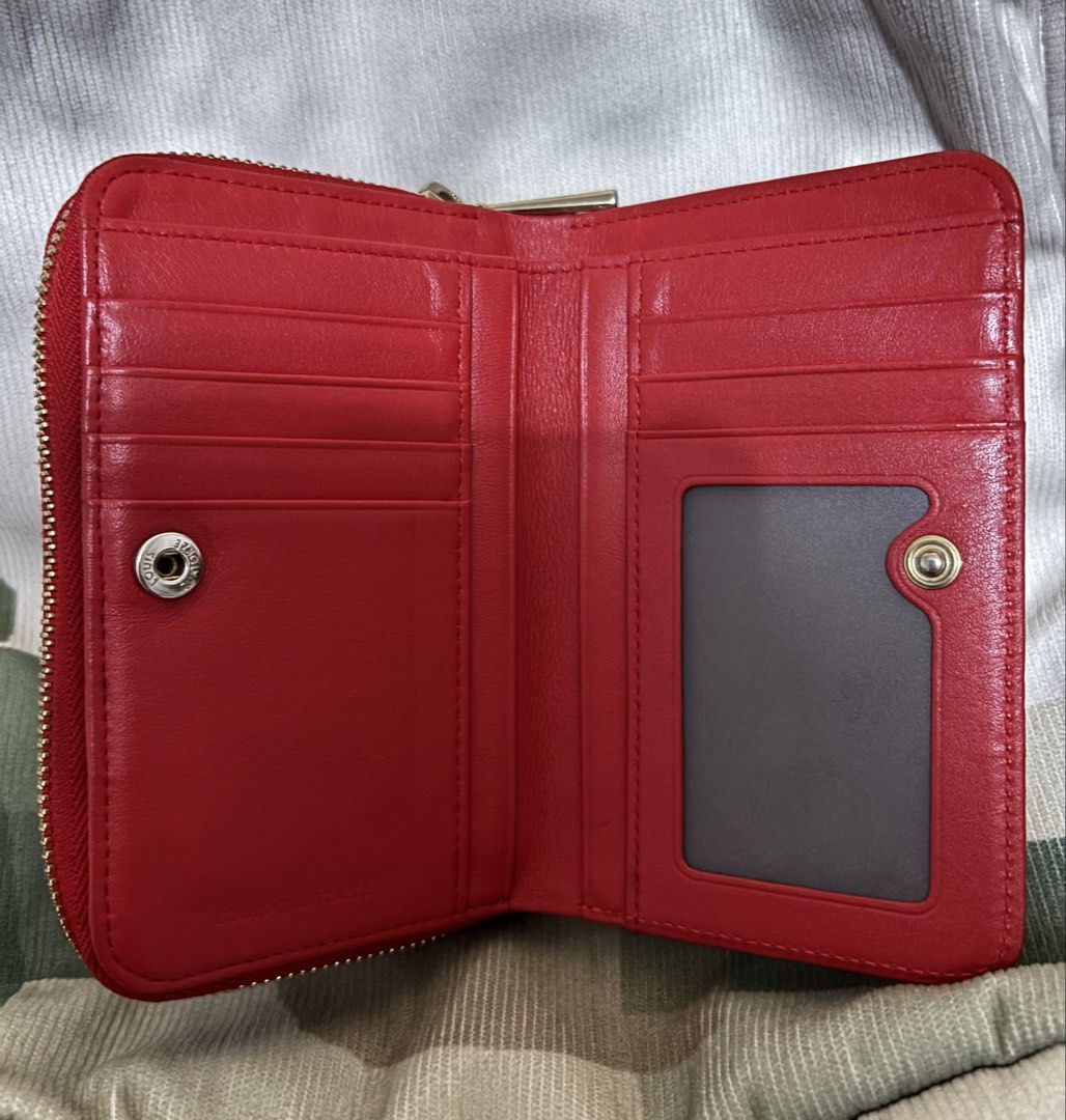 Louis Quatorze Red Leather Zip Around Wallet (Category: Wallets & Card holders) located in Naga. Submitted by taurusg (Listing ID 1458894233, Image 3). Description: - Authentic Louis Quatorze orange red leather wallet - Secure zip-around closure - Multiple card slots and clear ID window - Convenient coin pocket with snap closure - Minor marks on the exterior back - Zippers are in smooth working condition - Medium size -ykk zip .