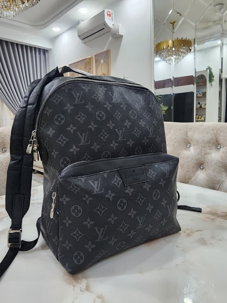 Louis Vuitton Monogram Eclipse Backpack (Category: Bags & Wallets) located in Seri Kembangan. Submitted by adeliash1443745 (Listing ID 1459024291, Image 2). Description: - Louis Vuitton backpack - Monogram Eclipse canvas - Front zip pocket - Interior: Main compartment + smaller pocket - Made in France.
