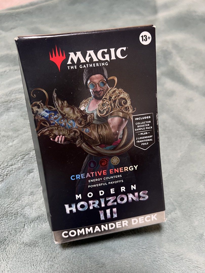Magic The Gathering Modern Horizons III Creative Energy Commander Deck (Category: Card Packs) located in Muntinlupa City. Submitted by omeletterice11 (Listing ID 1458916779, Image 1). Description: - Modern Horizons III Creative Energy Commander Deck - Focuses on energy counters and powerful payoffs - Includes a Collector Booster Sample Pack - Comes with 2 legendary traditional foil cards - Features Satya, Aetherflux Genius - Perfect for Commander